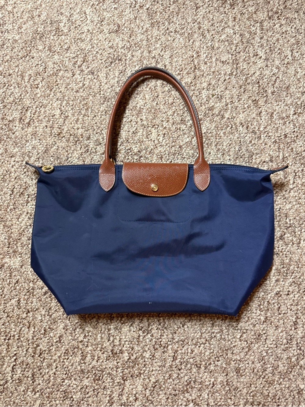 Longchamp Le Pliage Large Navy Tote with Brown Leather Trim.